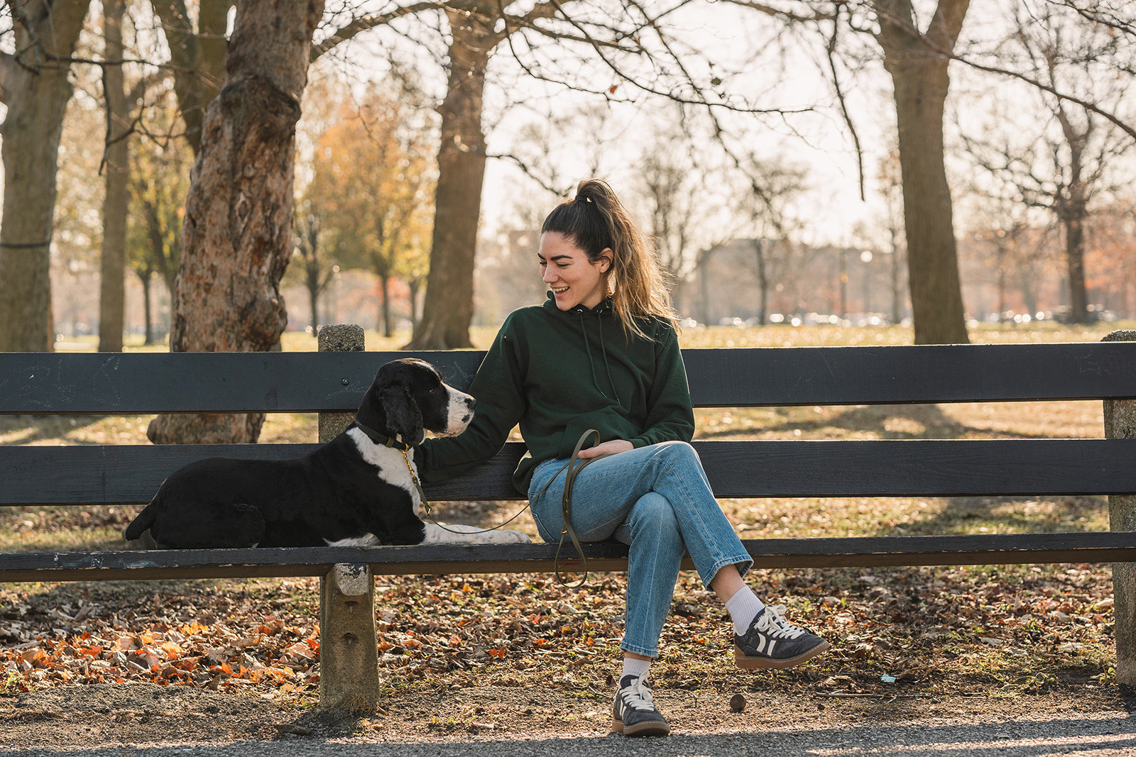 Maddie and Rudder sitting together on a park bench